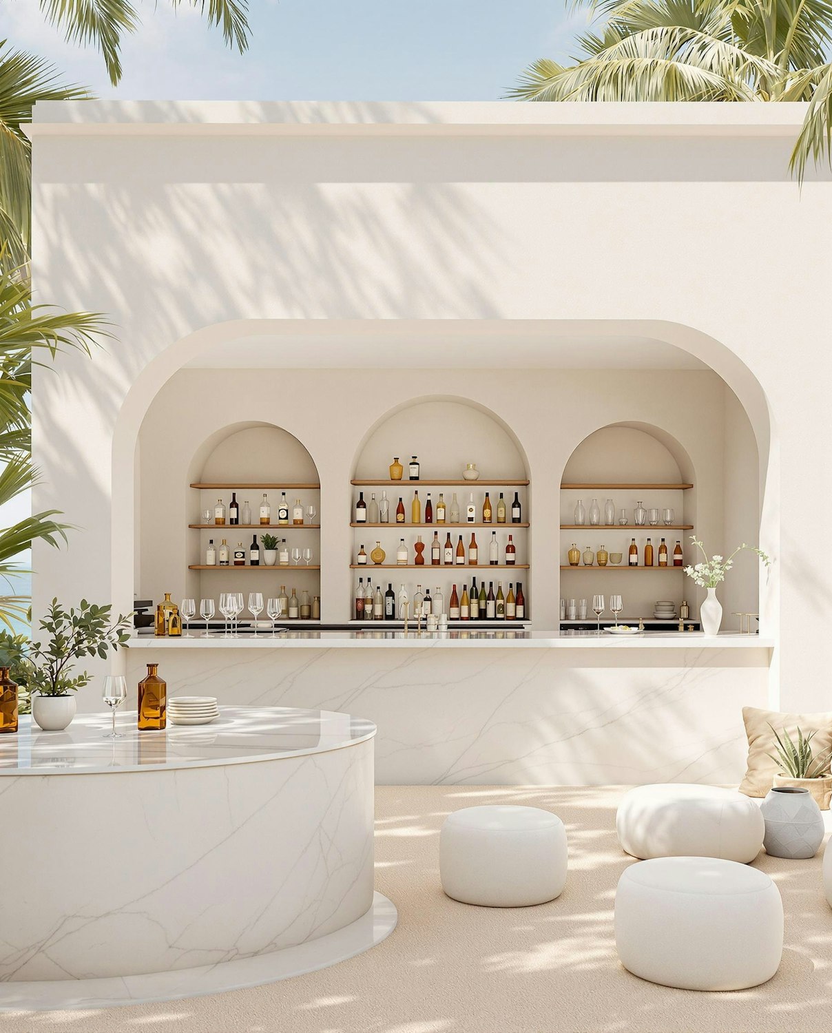 An outdoor bar with white marble counters, arched shelving behind and planted greenery around the edges